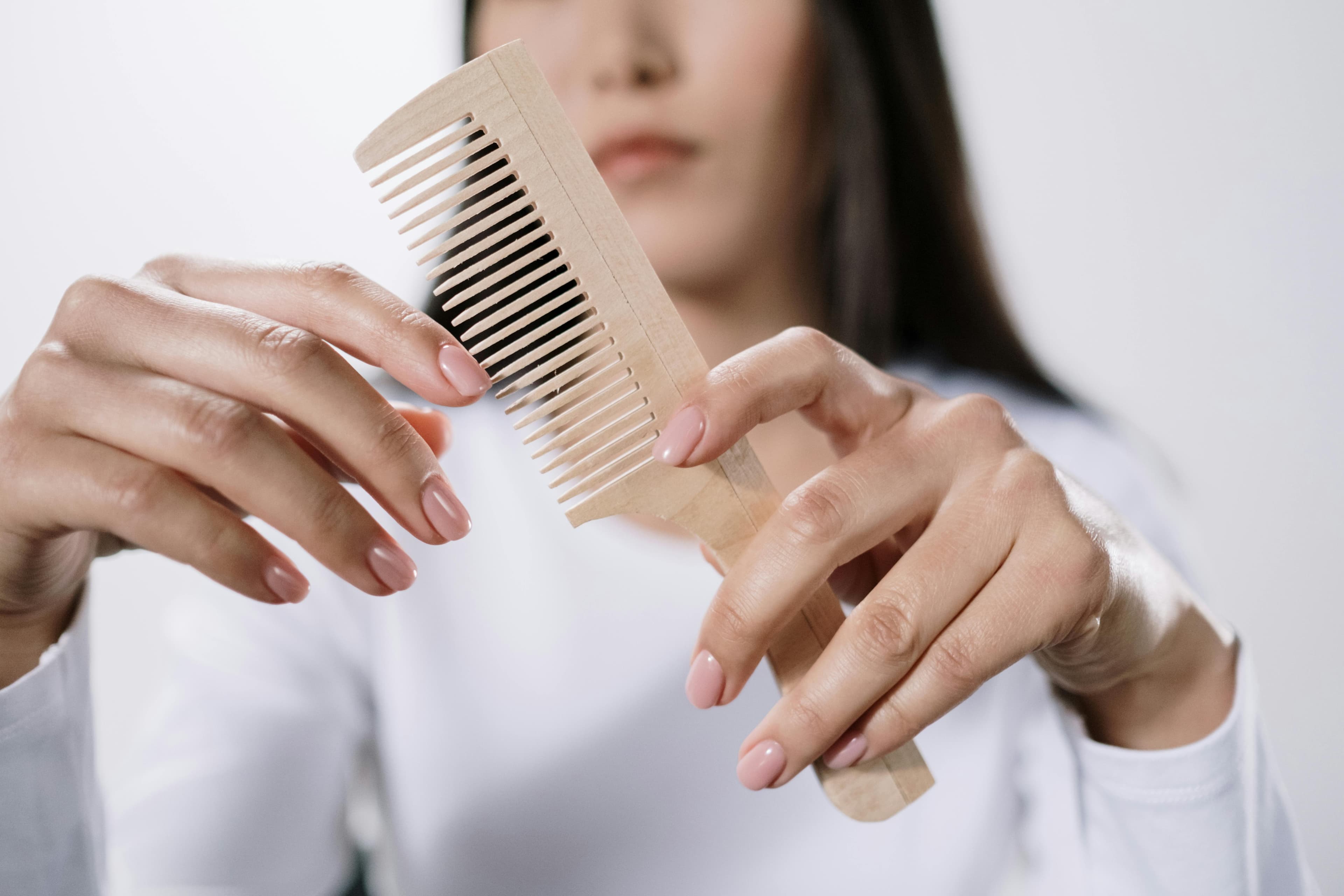 C2 Hair care products including wide-tooth comb, sulfate-free shampoo, and microfiber towel